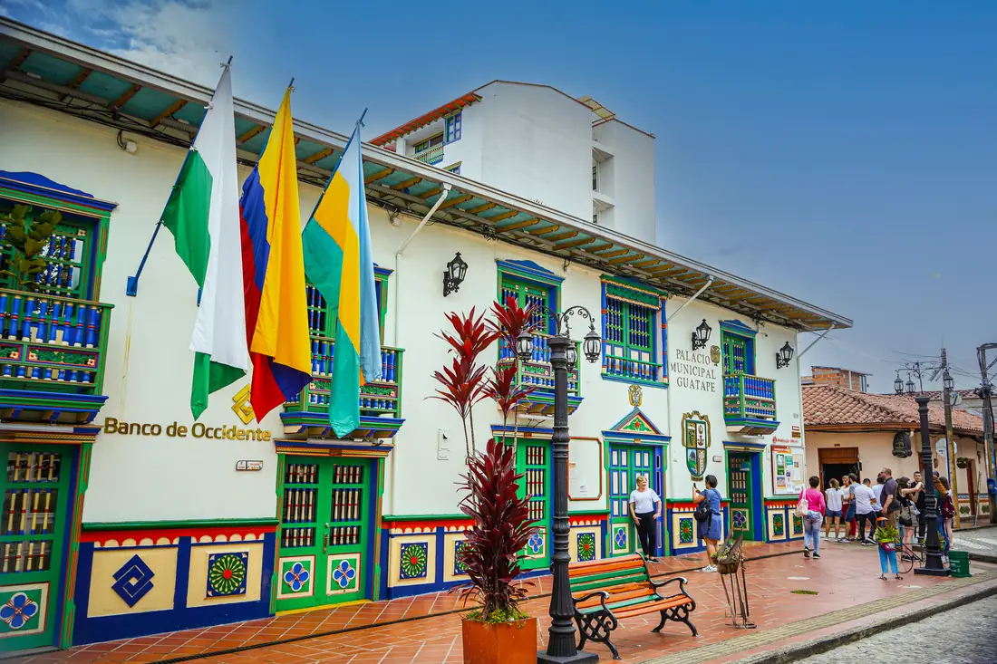 Guatapé's Palacio Municipal with the flags of Antioquia, Colombia and the municipality.